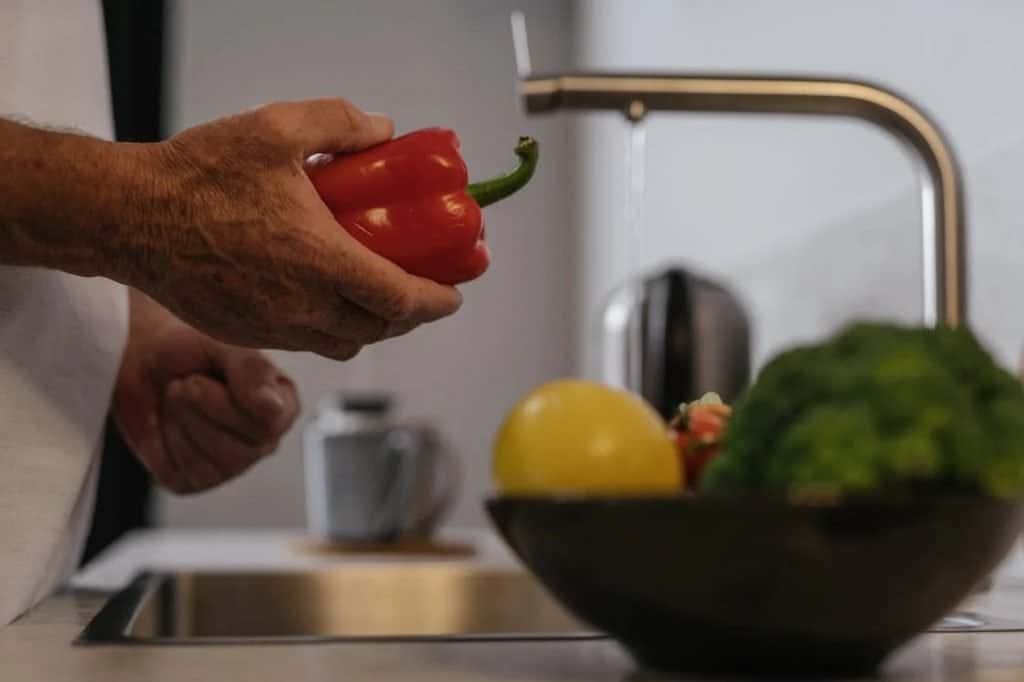 Image of Person Holding Red Bell Pepper