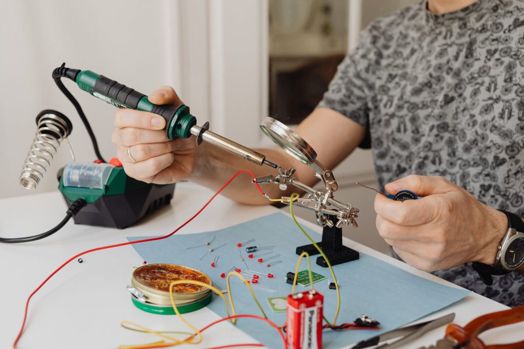 Image of A Person Using a Soldering Iron
