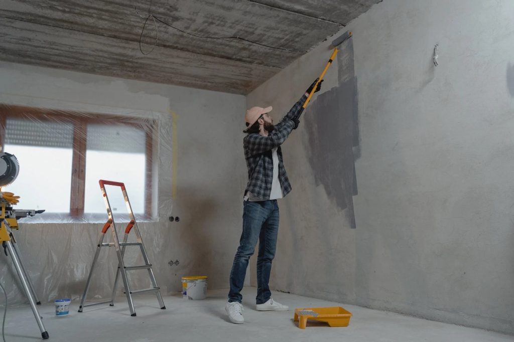 Image of Man Painting the Wall