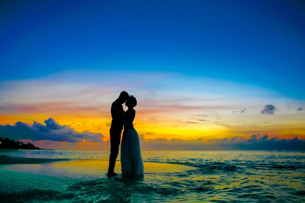 Image of Man and Woman Standing at Seashore