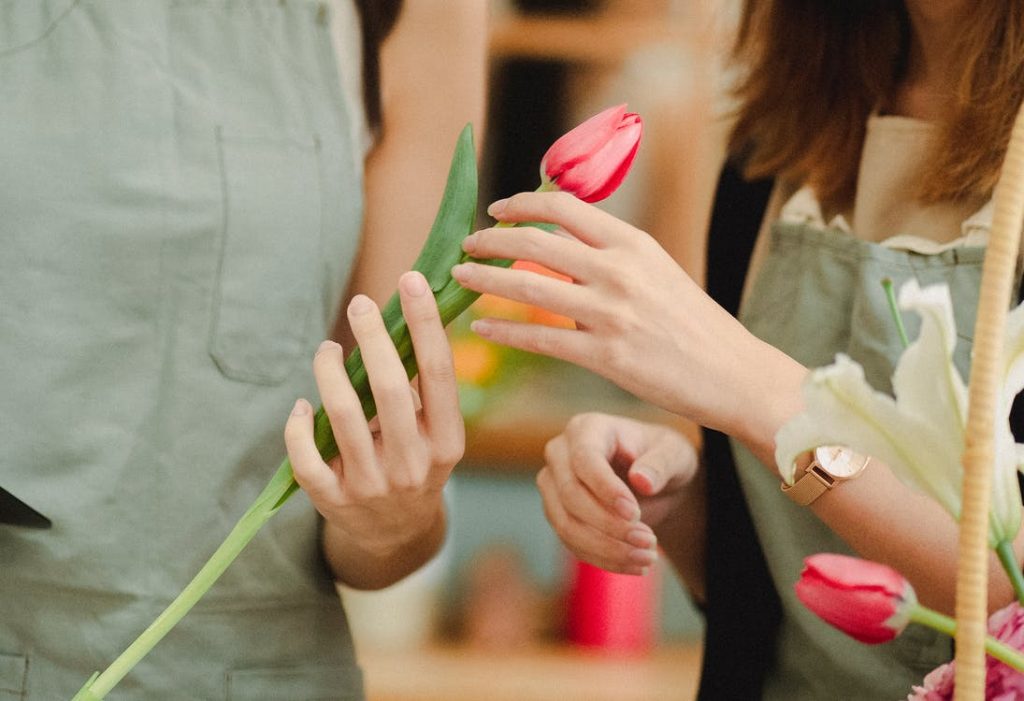 Image of women with tulip in florist atelier