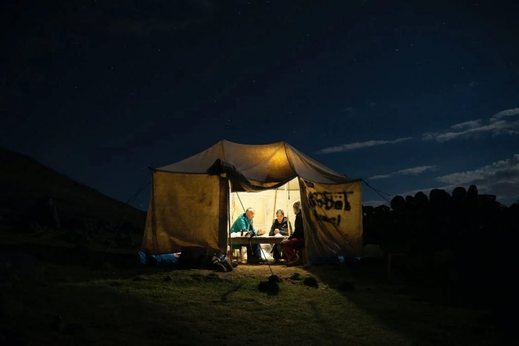 Image of People Sitting Inside a Tent