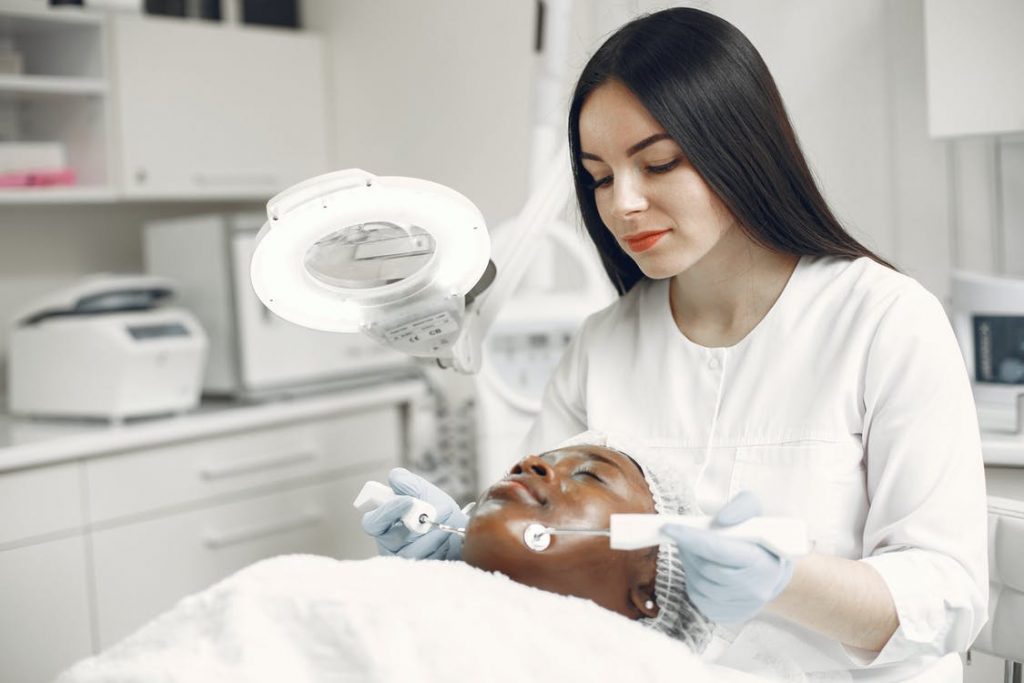Image of A Specialist Doing Skin Care Program on a Client