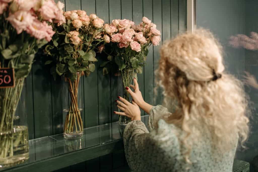 Image of Florist Putting Flowers on Display