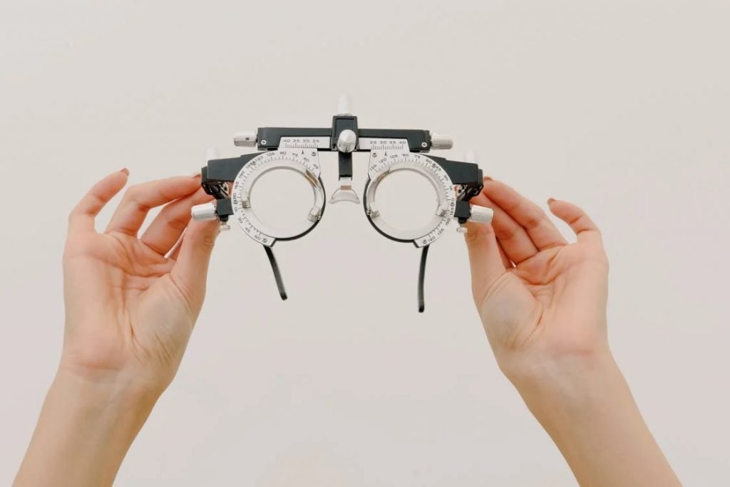 Image of woman holding trial frame
