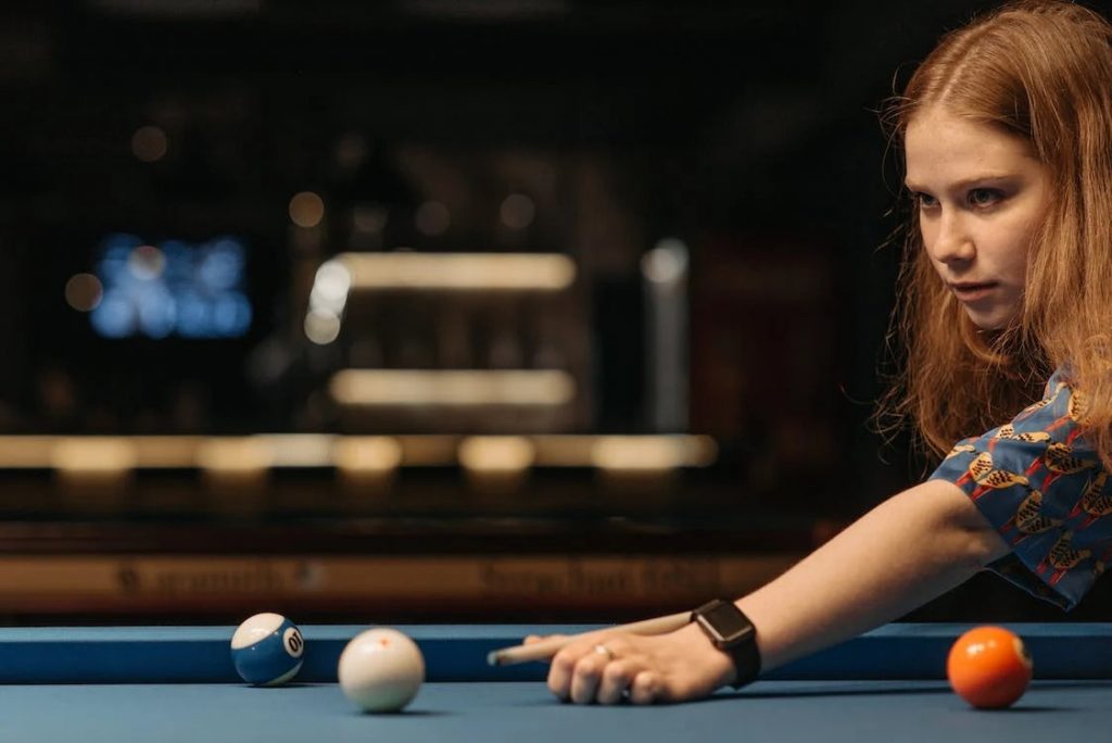 Image of Girl Playing Pool
